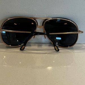 Tom Ford men’s double -bridge metal aviator sunglasses. In black color with gold